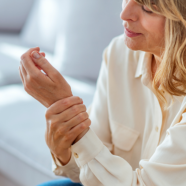 Woman holding her wrist