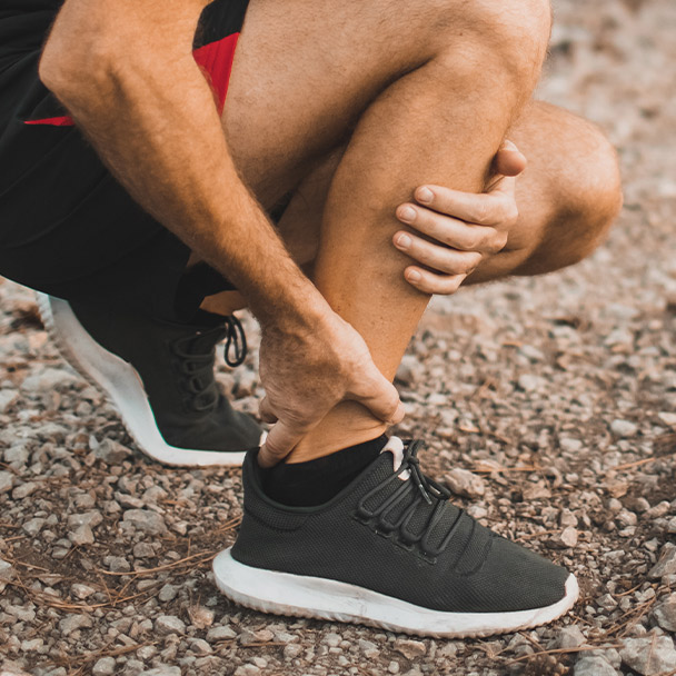 Man holding his ankle